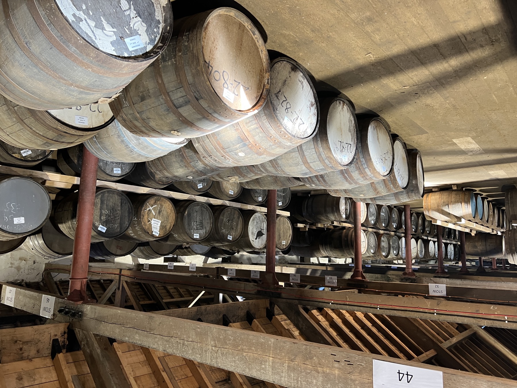Rows of casks stowed in a warehouse